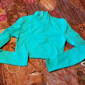 Green long sleeve back zipper half top. NEW